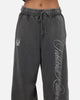 Mitchell & Ness Las Vegas Raiders Star Script Relaxed Track Pants Washed Black